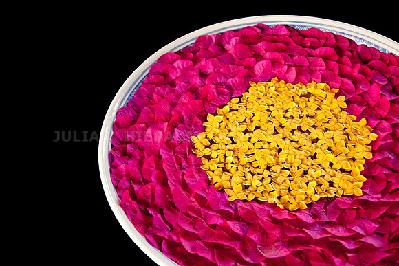 Bowl of Water Containing Flower Petals